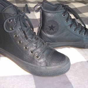 Unisex black leather Chuck Taylor high tops